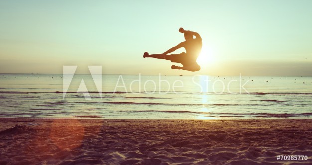 Picture of Flying kick on the beach